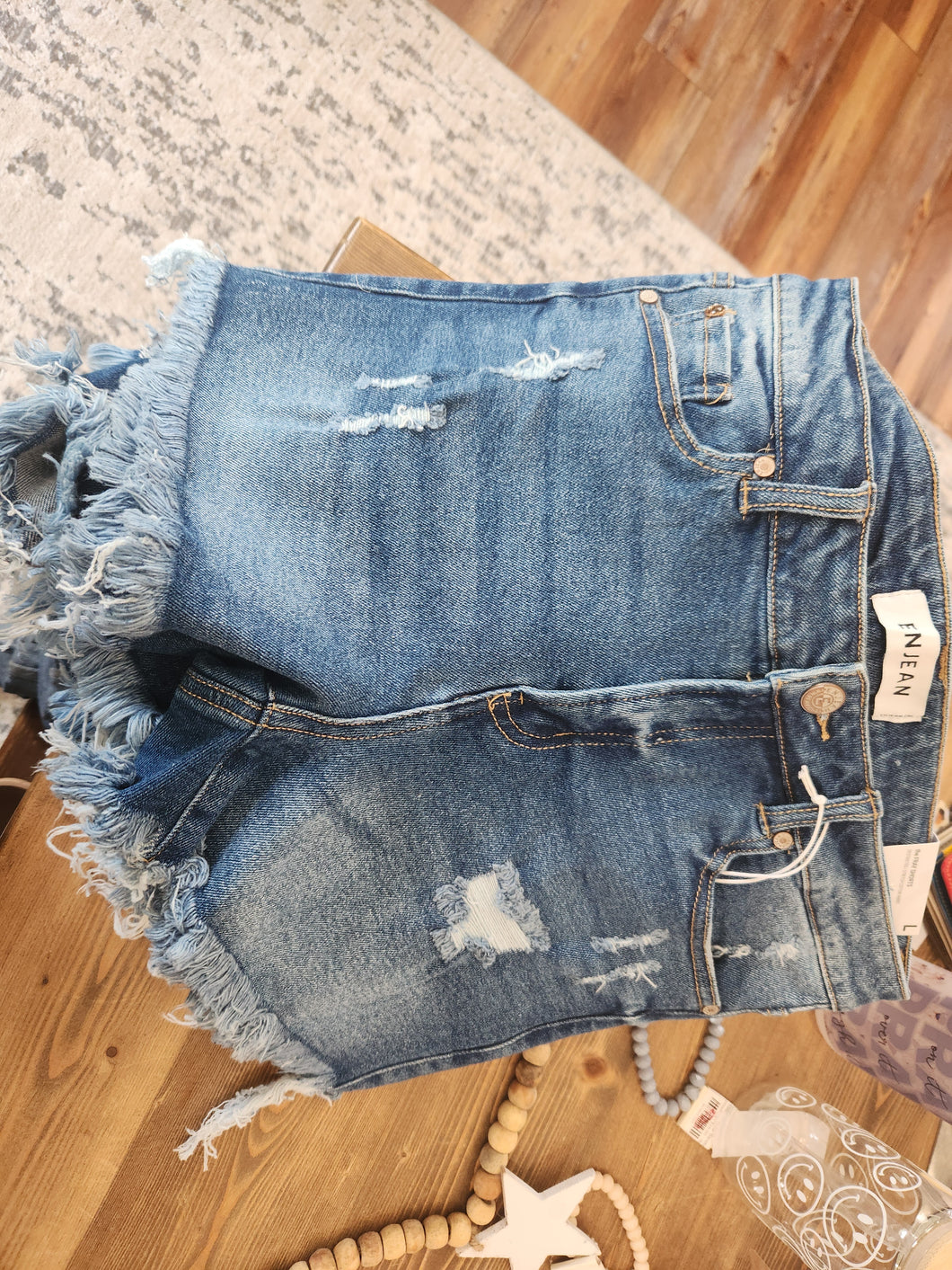 Enjean mid rise destructed fray shorts